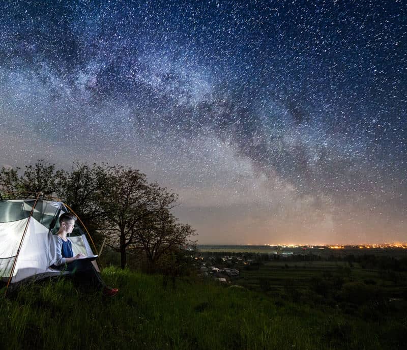 Milkyway Design - A person working remotely with a night sky showing the Milkyway